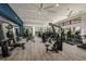 Modern fitness center with a variety of exercise equipment at 11822 Starbright Path, Venice, FL 34293