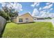 Backyard view showing a spacious grassy area and a fence at 122 Orange Bud Way, Plant City, FL 33563