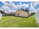 Spacious backyard with grassy area and white vinyl fence at 122 Orange Bud Way, Plant City, FL 33563