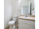 Simple bathroom with toilet, sink, and vanity at 122 Orange Bud Way, Plant City, FL 33563