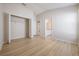 Well-lit bedroom with vinyl flooring and en-suite bathroom access at 122 Orange Bud Way, Plant City, FL 33563