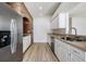 Modern kitchen with stainless steel appliances and brick accent wall at 122 Orange Bud Way, Plant City, FL 33563