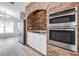 Stainless steel appliances built into a brick wall in this kitchen at 122 Orange Bud Way, Plant City, FL 33563