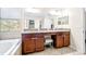 Double vanity with granite countertop in main bathroom at 12405 Crestridge Loop, New Port Richey, FL 34655