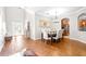 Elegant dining room with hardwood floors and a chandelier at 12405 Crestridge Loop, New Port Richey, FL 34655