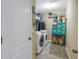 Well-equipped laundry room with washer, dryer, and ample storage at 12405 Crestridge Loop, New Port Richey, FL 34655