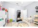 Playroom with toys, ball pit, and home gym equipment at 12405 Crestridge Loop, New Port Richey, FL 34655