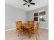 Dining room featuring a wooden table with six chairs and a window at 1264 Riserva Ln, Palm Harbor, FL 34683