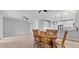 Dining room with wood table and chairs near kitchen at 1264 Riserva Ln, Palm Harbor, FL 34683