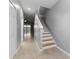 Hallway with view of the stairs and a doorway to the living room at 1264 Riserva Ln, Palm Harbor, FL 34683