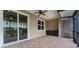 Screened lanai with tile floor and ceiling fan at 1264 Riserva Ln, Palm Harbor, FL 34683