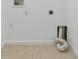 Laundry room includes tile floor and laundry hookups at 1264 Riserva Ln, Palm Harbor, FL 34683