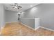 Upstairs loft area featuring hardwood floors, neutral walls and a half wall at 1264 Riserva Ln, Palm Harbor, FL 34683