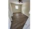 Bright bedroom with ceiling fan and dark laminate floors at 1348 Impatiens Ct, Trinity, FL 34655