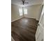 Bright bedroom featuring wood-look floors at 1348 Impatiens Ct, Trinity, FL 34655