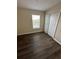 Bedroom with double door closet and laminate flooring at 1348 Impatiens Ct, Trinity, FL 34655