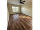 Bedroom with ceiling fan and dark brown tile flooring at 1348 Impatiens Ct, Trinity, FL 34655