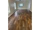 Spacious living room featuring dark brown tile flooring at 1348 Impatiens Ct, Trinity, FL 34655