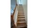 Wooden staircase with a simple, clean design at 1348 Impatiens Ct, Trinity, FL 34655