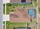 Bird's eye view of a house with a screened pool and fenced backyard at 14638 Strathglass Dr, Hudson, FL 34667