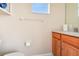 Small bathroom with wood cabinets and a toilet at 14638 Strathglass Dr, Hudson, FL 34667