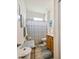 Simple bathroom with shower, toilet and vanity at 14638 Strathglass Dr, Hudson, FL 34667