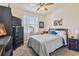 Bedroom with double bed, dresser, and large window at 14638 Strathglass Dr, Hudson, FL 34667