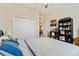 Bedroom with a double bed, ceiling fan and built-in shelving at 14638 Strathglass Dr, Hudson, FL 34667