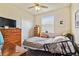 Bedroom with a twin bed, dresser, and double door closet at 14638 Strathglass Dr, Hudson, FL 34667