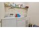 Laundry room with washer, dryer, and utility sink at 14638 Strathglass Dr, Hudson, FL 34667