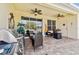 Covered patio with grill, seating, and ceiling fans at 14638 Strathglass Dr, Hudson, FL 34667