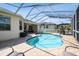 Enjoy this refreshing kidney-shaped pool with a screened enclosure at 14638 Strathglass Dr, Hudson, FL 34667