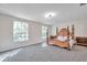 Main bedroom with large windows and plush carpeting at 1542 Mccrea Dr, Lutz, FL 33549