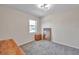 Charming bedroom with gray carpet, a dresser and a large mirror at 1542 Mccrea Dr, Lutz, FL 33549