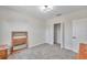 Well-lit bedroom with mirror and built in closet at 1542 Mccrea Dr, Lutz, FL 33549