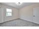 Spacious bedroom with neutral decor and carpet at 1542 Mccrea Dr, Lutz, FL 33549