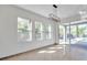 Sunlit dining room, pool view, granite floor at 1542 Mccrea Dr, Lutz, FL 33549