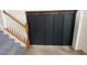 Entryway with dark accent wall and coat hooks at 1542 Mccrea Dr, Lutz, FL 33549