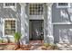 Two-story house with gray siding, a black door, and a gray garage at 1542 Mccrea Dr, Lutz, FL 33549