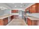 Modern kitchen with stainless steel appliances and wood cabinets at 1542 Mccrea Dr, Lutz, FL 33549