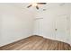 Bright bedroom with wood-look floors and ceiling fan at 15958 Adobe Dr, Hudson, FL 34667