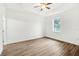 Spacious bedroom with large window and ceiling fan at 15958 Adobe Dr, Hudson, FL 34667