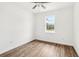 Cozy bedroom with wood-look floors and ceiling fan at 15958 Adobe Dr, Hudson, FL 34667