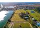 Aerial view of property showing house, land, and lake at 18029 Lake Reflections Blvd, Lutz, FL 33558