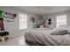 Bedroom with hanging chair and light-grey bedding at 18029 Lake Reflections Blvd, Lutz, FL 33558