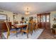 Elegant dining room with hardwood floors, a wood table, and built-in hutch at 18029 Lake Reflections Blvd, Lutz, FL 33558