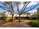 Two-story home with stone accents and a large front porch at 18029 Lake Reflections Blvd, Lutz, FL 33558