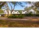 Another view of the house's exterior, highlighting its size and design at 18029 Lake Reflections Blvd, Lutz, FL 33558