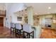 Kitchen with island, granite countertops, and green cabinets at 18029 Lake Reflections Blvd, Lutz, FL 33558