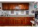 Kitchen with wood cabinets and granite countertops at 18029 Lake Reflections Blvd, Lutz, FL 33558